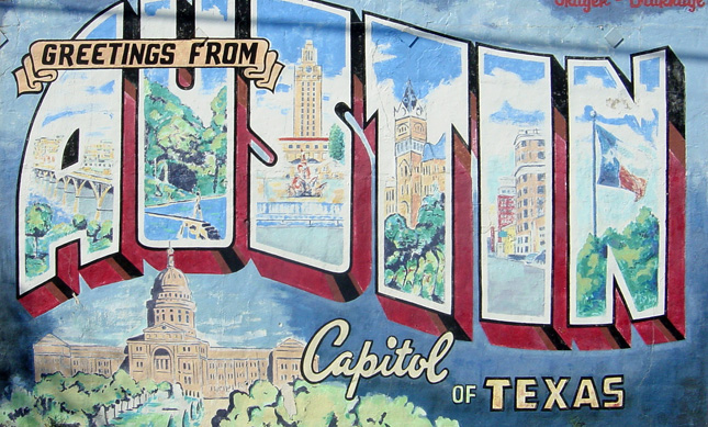Painted mural that says Greetings from Austin, Capitol of Texas.